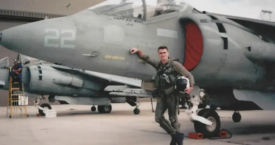 Wraith Systems owner standing in front of an airplane.